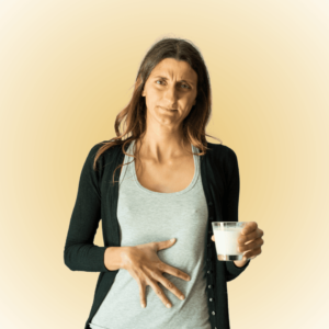 une femme se touche le ventre pour des problèmes digestifs
